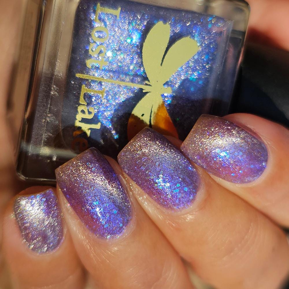 NORAD Santa Tracker | Magnetic pale periwinkle jelly with scattered green and purple holo flecks