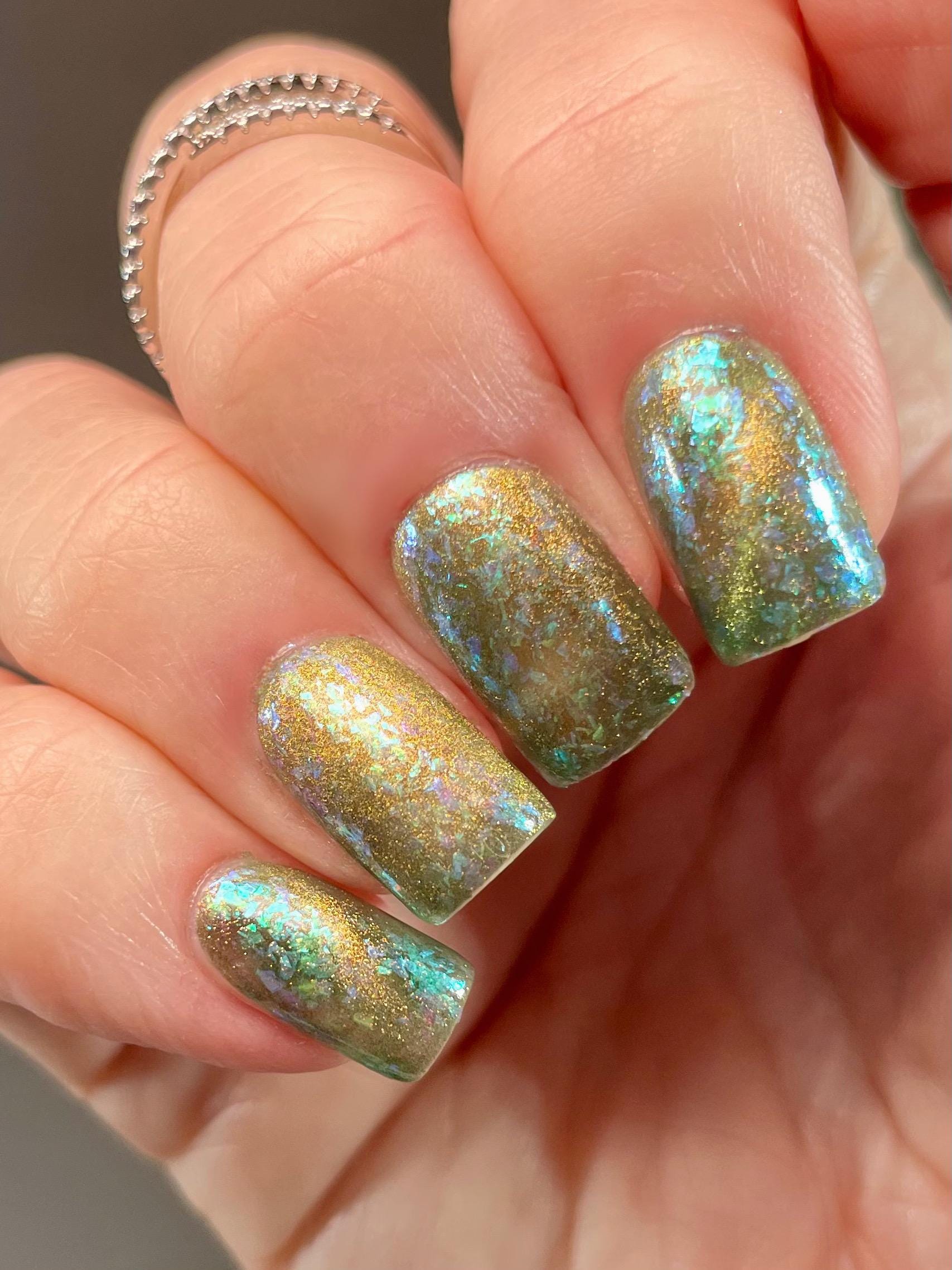 A Light in the Forest | Green & Gold magnetic nail polish with shifting auroral flakies
