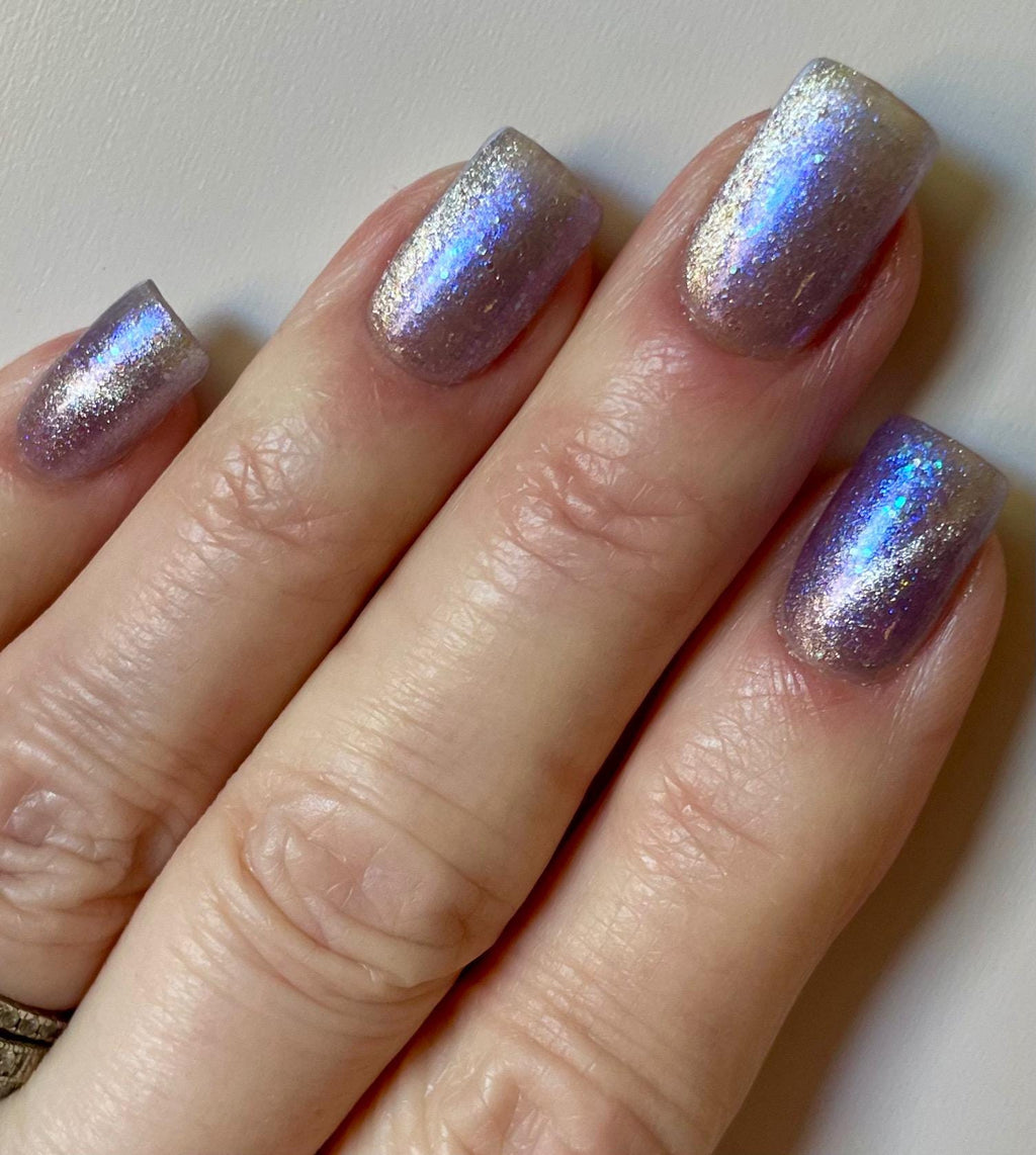 NORAD Santa Tracker | Magnetic pale periwinkle jelly with scattered green and purple holo flecks
