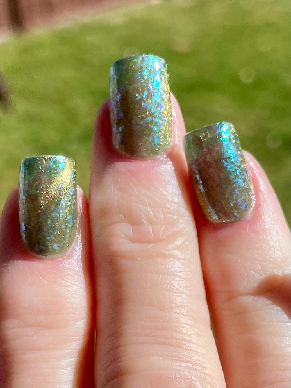 A Light in the Forest | Green & Gold magnetic nail polish with shifting auroral flakies