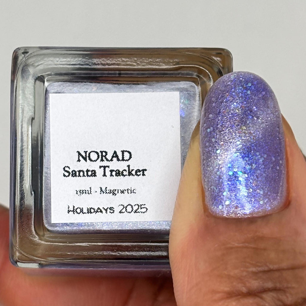 NORAD Santa Tracker | Magnetic pale periwinkle jelly with scattered green and purple holo flecks