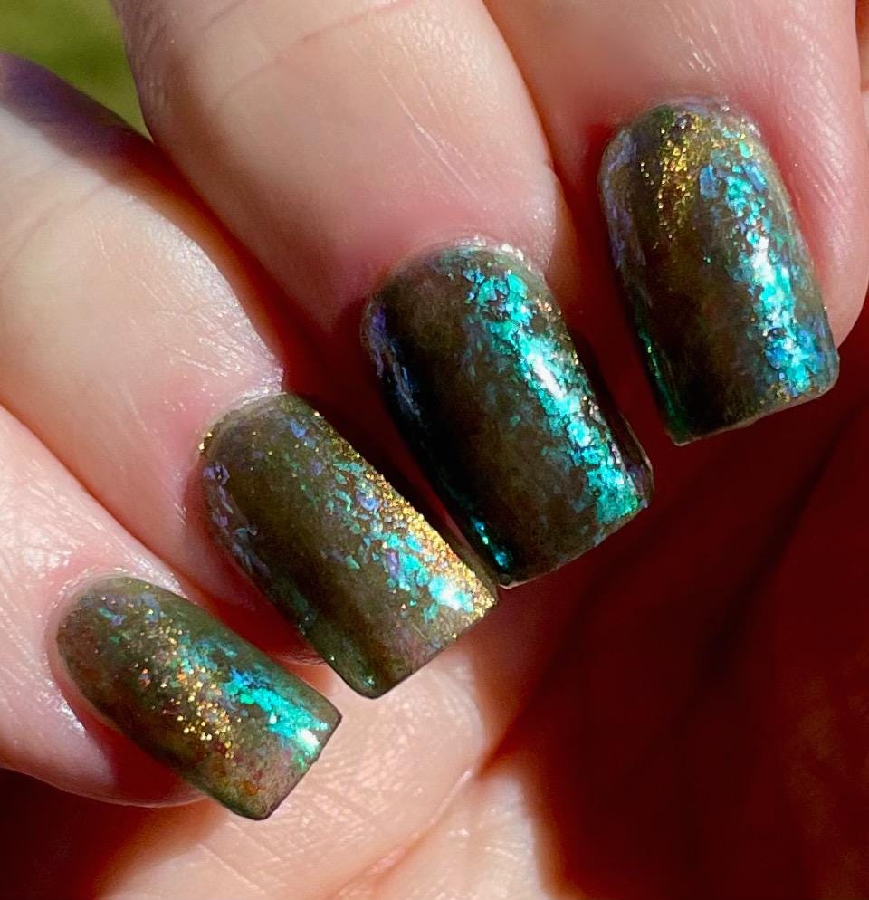 A Light in the Forest | Green & Gold magnetic nail polish with shifting auroral flakies