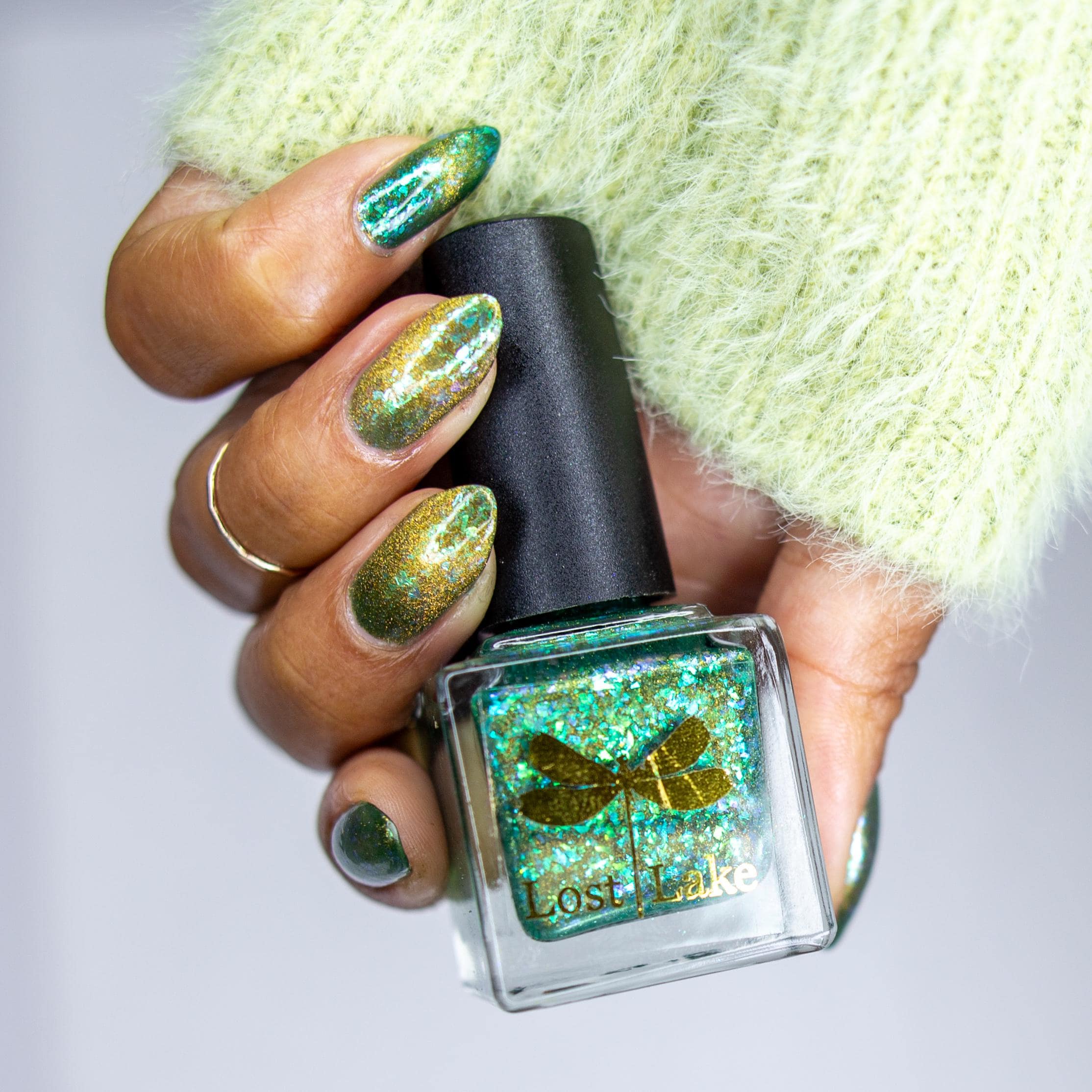 A Light in the Forest | Green & Gold magnetic nail polish with shifting auroral flakies